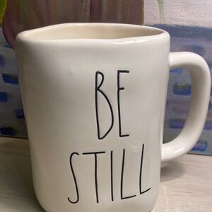 Rae Dunn Cream Mug with 'Be Still' Text